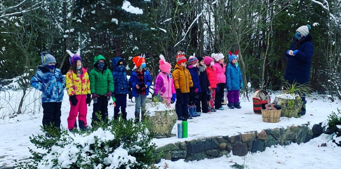 children standing in line in the snow