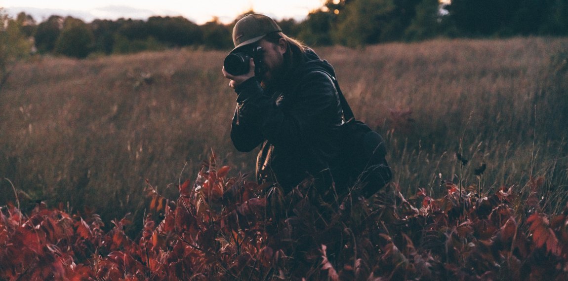 photographer in a field